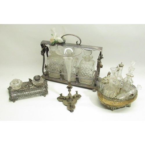 381 - Silver plate tantalus with 3 glass decanters, silver plate desk inkwell and 2 other silver plated it... 