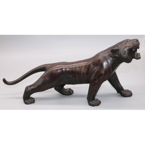 1142 - Japanese Meiji period patinated bronze model of a prowling tiger, with glass eyes and open mouth, se... 