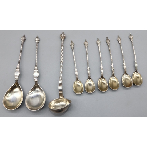 1079 - Pair of C20th Danish silver serving spoons, with mask head terminals, barley twist handles and pear ... 