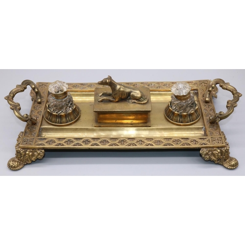 1145 - Victorian brass rectangular inkstand with gothic cast border and scroll handles, two glass wells and... 