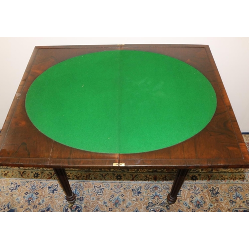 1405 - C19th Gillows style rosewood games table, swivel folding boxwood and ebonised baize lined chessboard... 