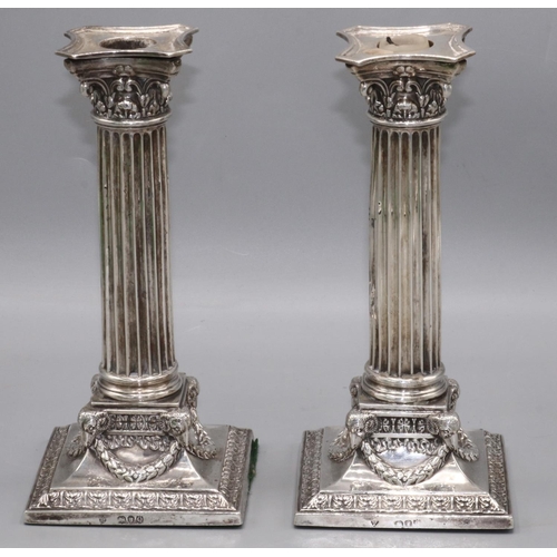 1075 - Pair of Victorian hallmarked silver Corinthian column candlesticks, on rams head, laurel wreath and ... 