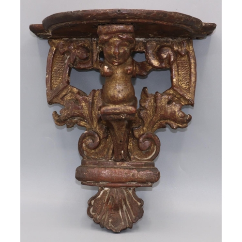 1148 - C19th carved oak giltwood wall bracket, shaped top on cherub, pierced scroll and shell support, H22c... 