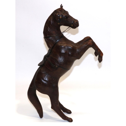 1161 - Brown leather covered model of a rearing horse, H45cm