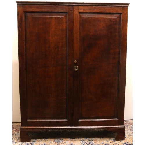 1406 - Early C19th oak Housekeepers cupboard, with moulded top above two fielded panel doors revealing two ... 