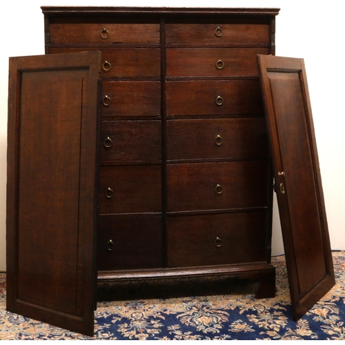 1406 - Early C19th oak Housekeepers cupboard, with moulded top above two fielded panel doors revealing two ... 