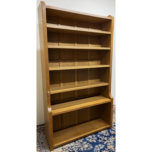 1483 - Robert Mouseman Thompson of Kilburn - an oak waterfall bookcase, panelled back with four adjustable ... 