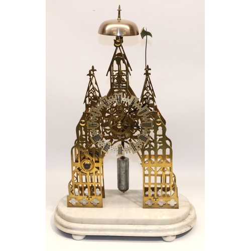 1249 - Victorian brass Cathedral style skeleton clock on stepped white marble base, the pierced frame of tr... 