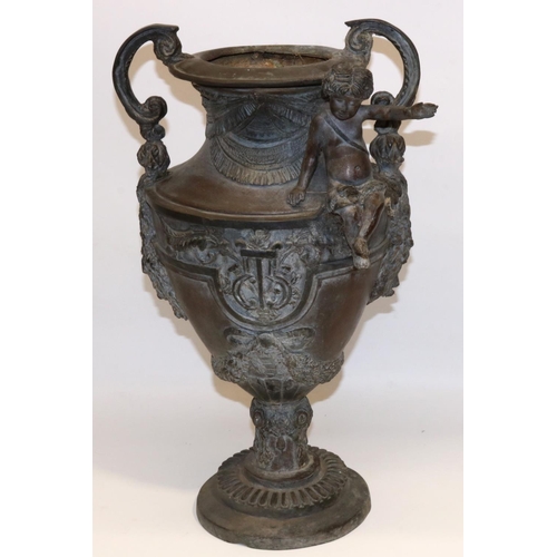 1137 - Large Victorian cast metal urn shaped two handled vase, decorated with a cherub, on circular base, H... 