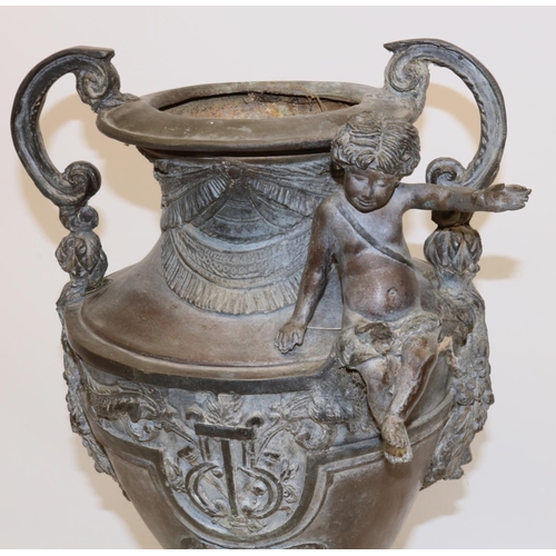 1137 - Large Victorian cast metal urn shaped two handled vase, decorated with a cherub, on circular base, H... 