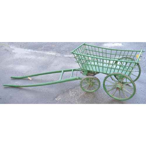 1497 - Early C20th green painted wooden Dog cart, spindle turned body with metal bound spoked wheels, W103c... 