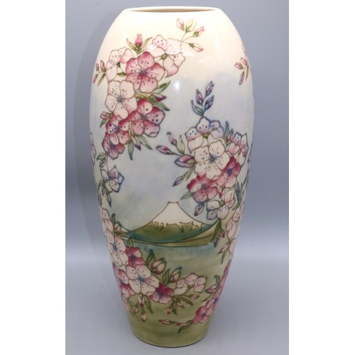 632 - Moorcroft Pottery: Spring Blossom pattern tall vase, tube lined decoration of pink flowers on gradua... 