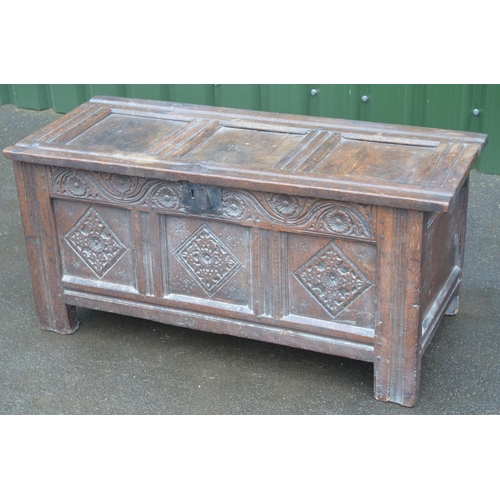 1419 - C17th carved oak coffer, hinged three panel lid above scroll and rosette frieze and three lozenge pa... 