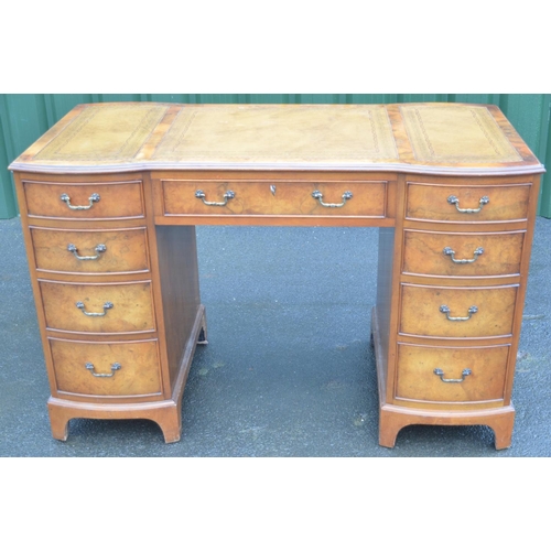 1420 - George 111 style figured walnut inverted bow breakfront pedestal desk, gilt tooled inset top above o... 