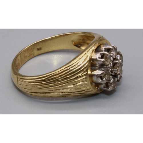 1044 - 18ct yellow gold diamond cluster ring, the seven brilliant cut diamonds on signet style textured ban... 