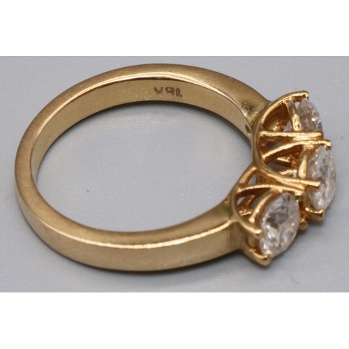1001 - 18ct yellow gold three stone diamond ring, the three brilliant cut diamonds in claw settings on cros... 