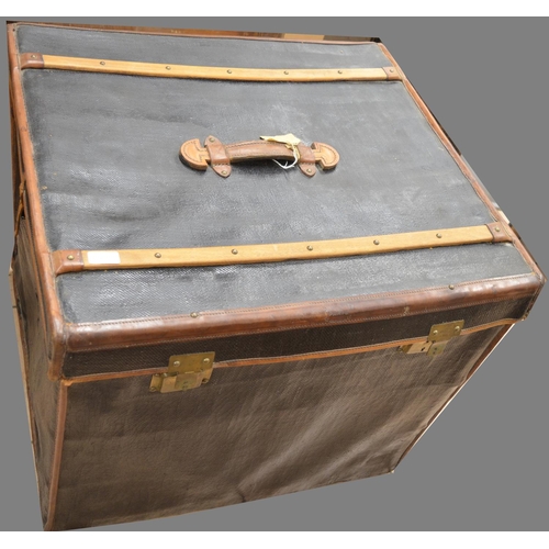 1439 - Early C20th large leather bound black painted travel trunk, hinged lid with wooden bands, original l... 