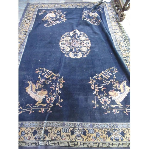 1310 - Blue ground Chinese carpet, with central stylized floral medallion in similar repeating border, appr... 