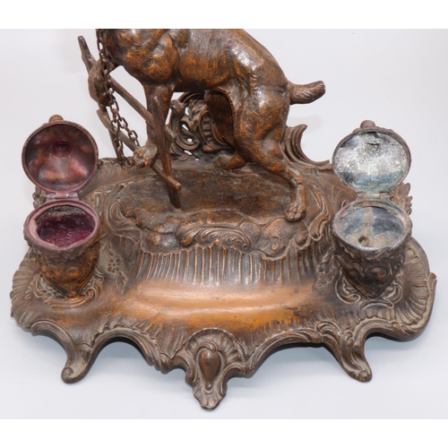 1140 - After A. Bossu (French C20th); Patinated spelter inkstand, with two urn shaped wells and a mastiff c... 