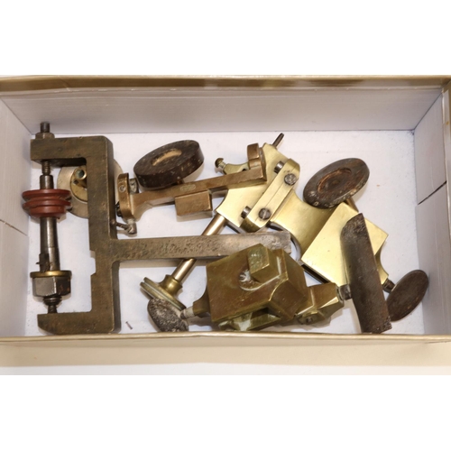 1258 - Victorian brass hand operated watchmakers' mandrel lathe, mounted on mahogany base together with acc... 