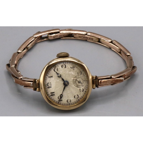 1071 - Swiss ladies gold wristwatch, silvered engine turned Arabic dial with subsidiary seconds, two piece ... 