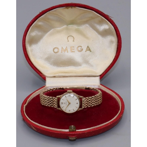 1065 - 1950's ladies Omega gold wristwatch, signed silvered dial with applied Arabic and baton hours, two p... 