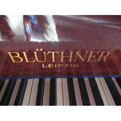 1162 - Bluthner Baby Grand Piano, metal framed overstrung movement in mahogany case with arched solid music... 