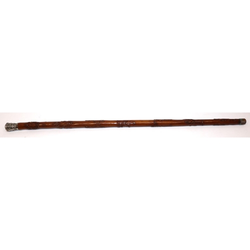 1172 - Victorian carved walking cane with unmarked Indian white metal grip, the shaft relief carved with Ro... 