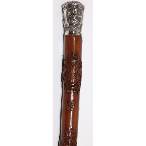 1172 - Victorian carved walking cane with unmarked Indian white metal grip, the shaft relief carved with Ro... 