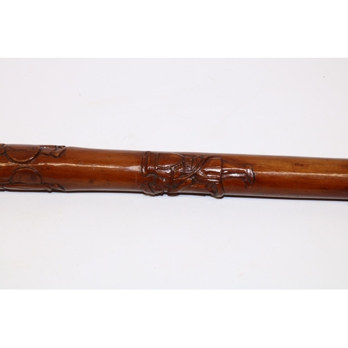 1172 - Victorian carved walking cane with unmarked Indian white metal grip, the shaft relief carved with Ro... 