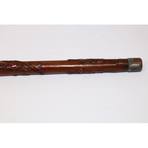 1172 - Victorian carved walking cane with unmarked Indian white metal grip, the shaft relief carved with Ro... 