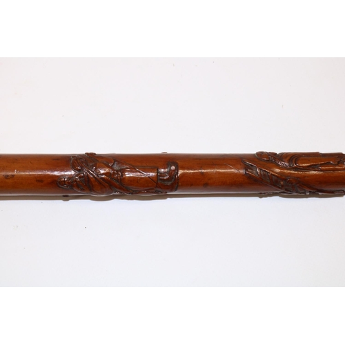 1172 - Victorian carved walking cane with unmarked Indian white metal grip, the shaft relief carved with Ro... 