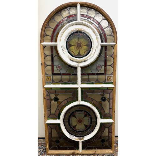 1130 - Victorian arched stained glass window, with two rose panels enclosed by geometric surround, H160cm W... 