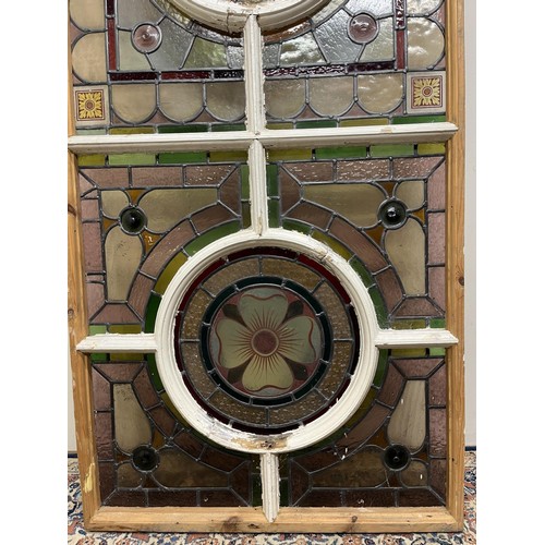 1130 - Victorian arched stained glass window, with two rose panels enclosed by geometric surround, H160cm W... 