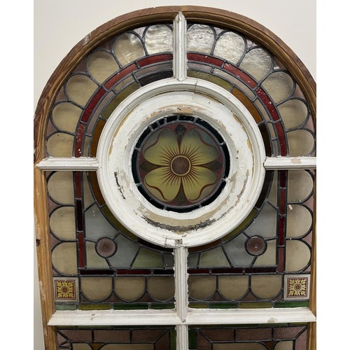 1130 - Victorian arched stained glass window, with two rose panels enclosed by geometric surround, H160cm W... 