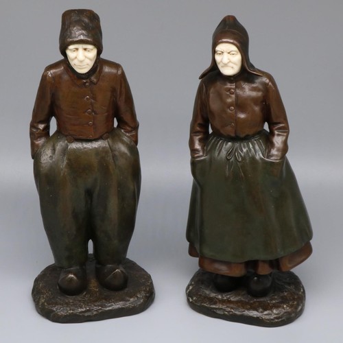 1133 - Paul D'Aire (French early C20th); Pair of green and brown patinated bronze and ivory figures of Dutc... 