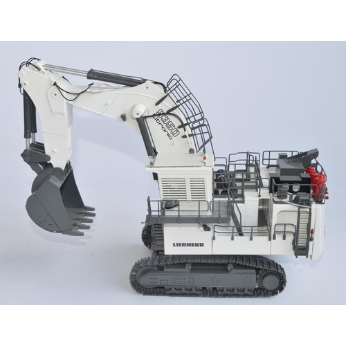Boxed highly detailed NZG 1/50 scale diecast Liebherr R9350 Litronic Hydraulic Excavator model (Art No 662) in excellent/near mint condition, box excellent. Model with working metal tracks with positionable shovel and arm, with spare track links