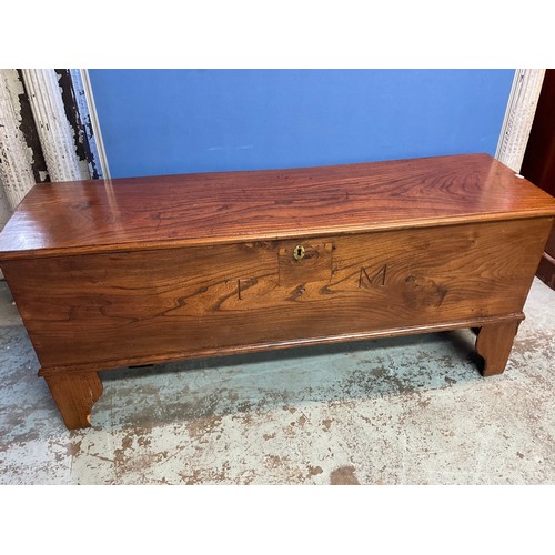 679 - C19th elm planked coffer hinged top with two interior drawers and a concealed drawer, on bracket fee... 