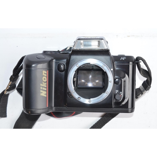 414 - Collection of 35mm film camera equipment and accessories to include a Nikon F401 SLR (in excellent e... 