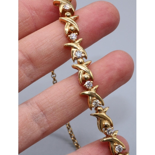 11 - 18ct yellow gold diamond cross link bracelet, set with twenty brilliant cut diamonds, box link closu... 