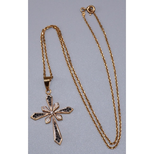 26 - Yellow metal cross pendant set with brilliant cut diamonds and sapphires, on 18ct yellow gold chain,... 