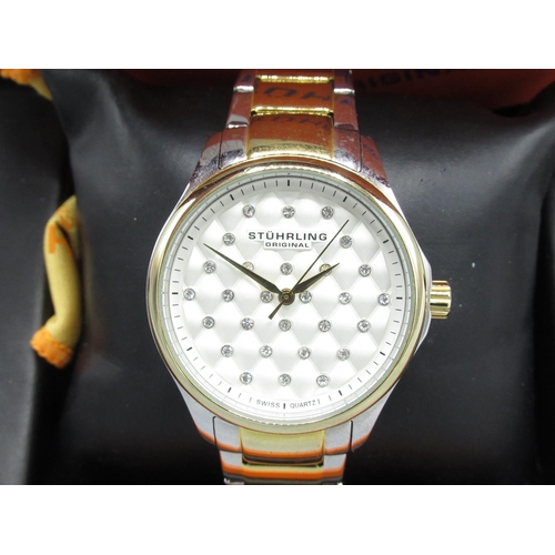 72 - Stuhrling Vogue ladies chrome and gold plated quartz wristwatch on matching bracelet, signed texture... 