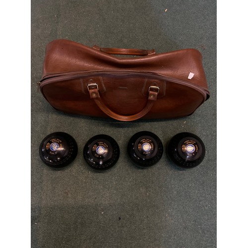 465 - Four Thomas Taylor bowling woods with original bag, size 4