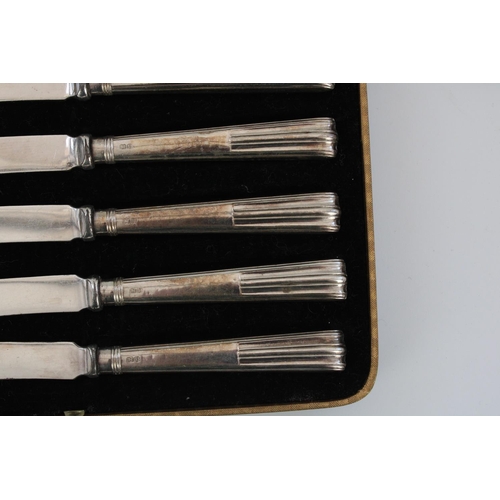 63 - Six cased Art Deco hallmarked silver butter knives with ribbed geometric handles, John Sanderson and... 