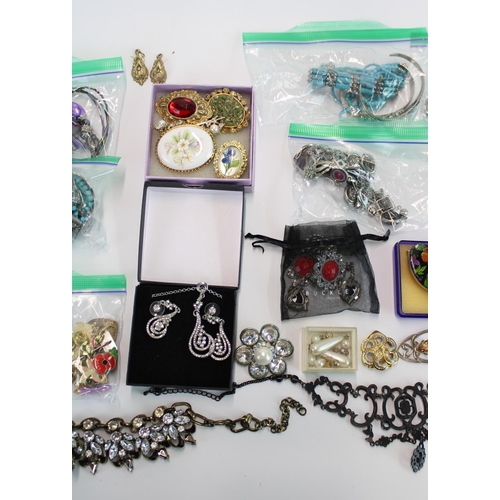 64A - Selection of costume jewellery and watches incl. necklaces, earrings, brooches together with a small... 