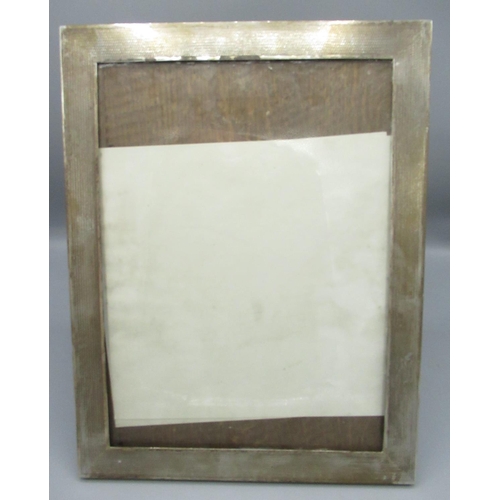 107 - Geo.V engine turned silver easel photograph frame, oak back, hallmarked Birmingham 1919, 25.6cm x 33... 