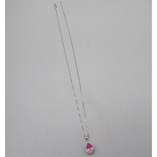 31 - 9ct white gold pendant set with teardrop cut pink stone surrounded by a halo of diamonds, on gold ch... 