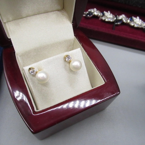 51 - Pair of gilded silver stud earrings set with faux pearls and clear stones, and a matching necklace, ... 