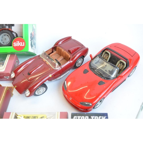 132 - Mixed lot of mostly diecast vehicle models to include Lledo, Corgi, Siku and Burago. Also included a... 