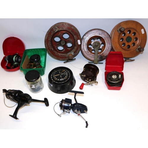 356 - Suunto K-123 marine compass, gimbal mounted in metal bracket, a collection of fishing sea reels, a D... 